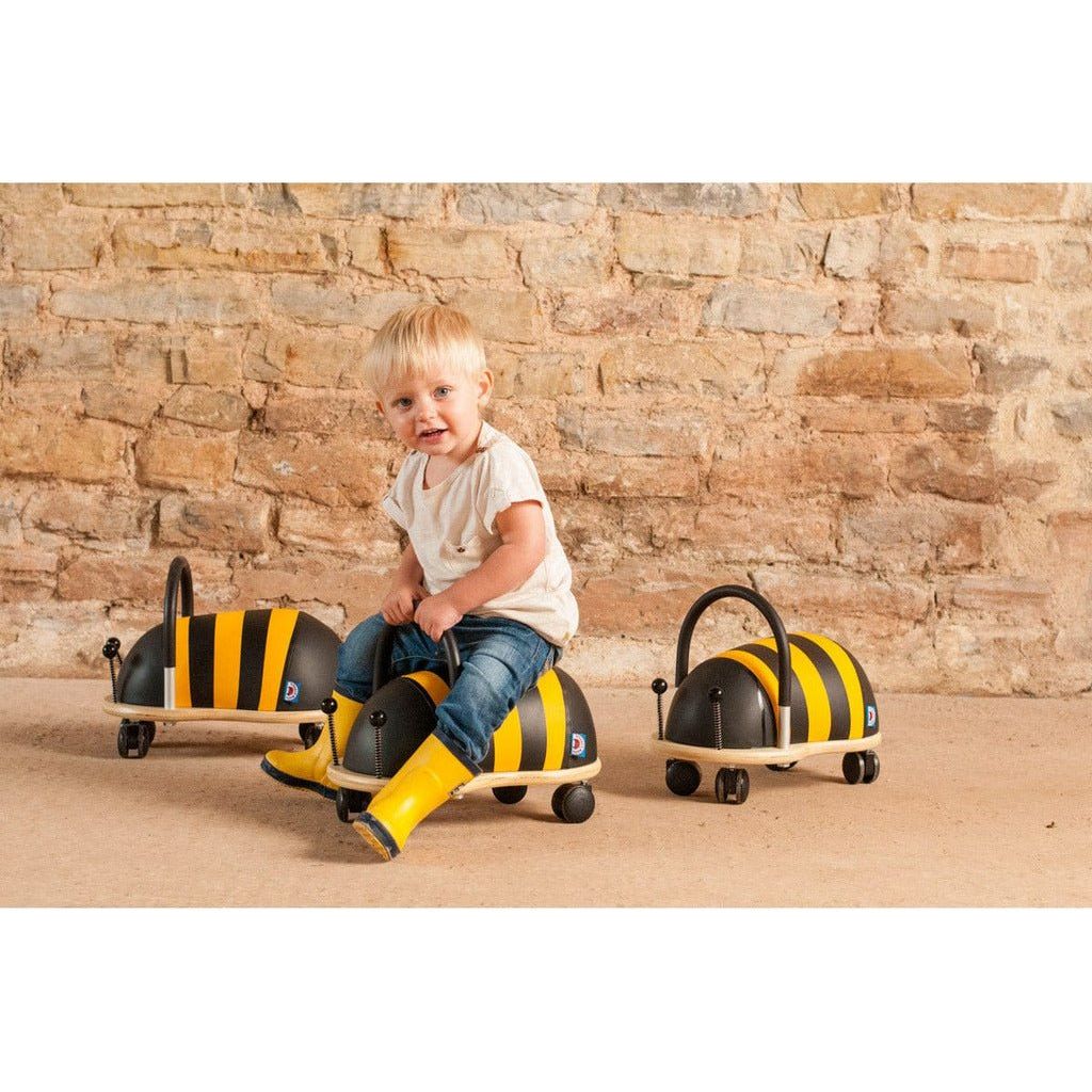 little boy riding Wheelybug Ride On - Bee