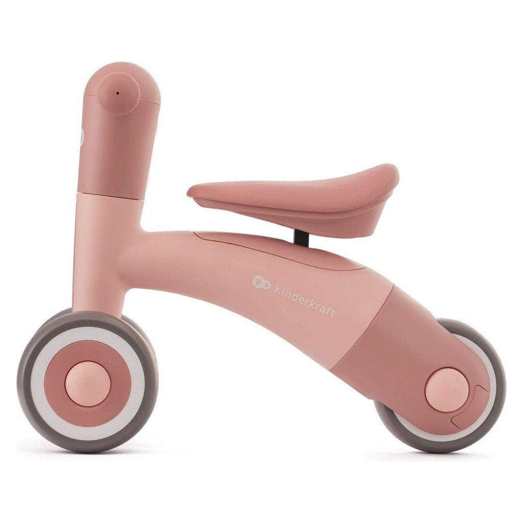 Pink Kinderkraft Minibi Tricycle side with raised seat