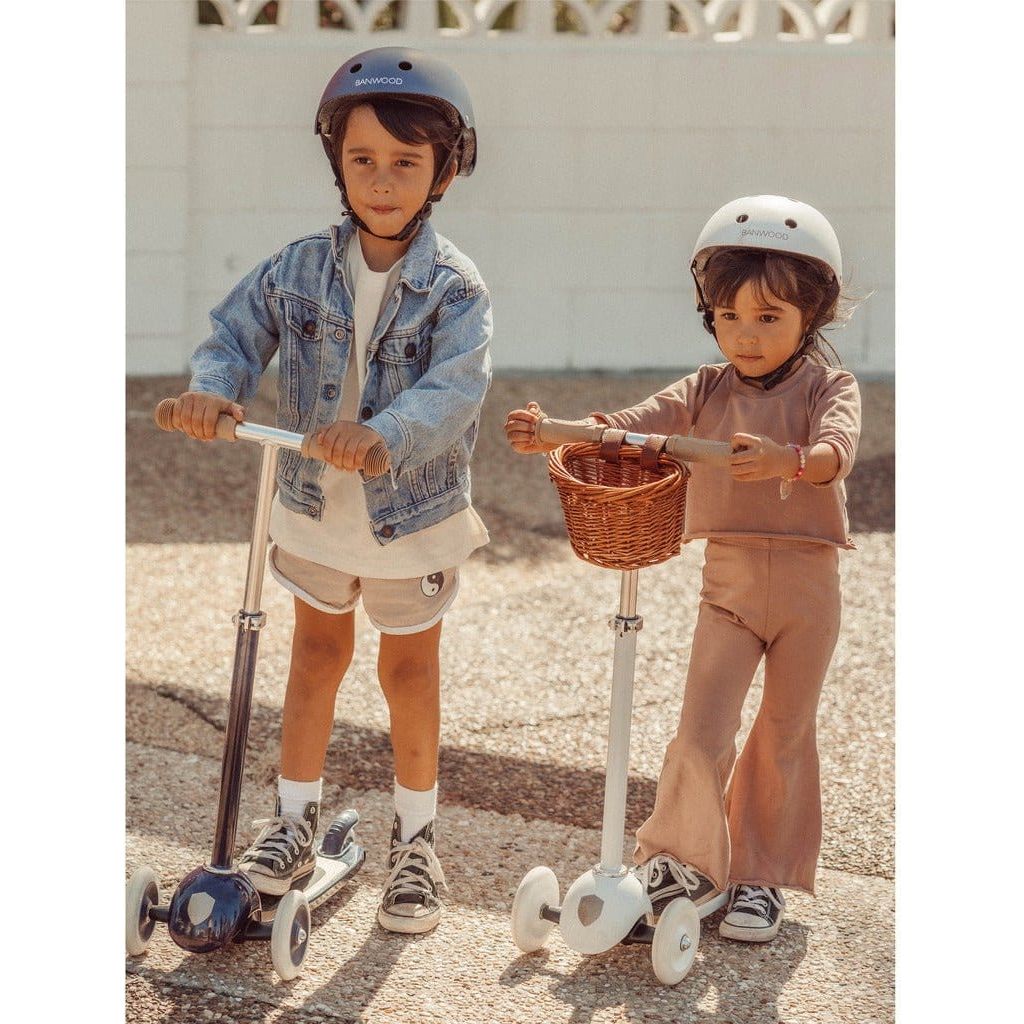 Little boy and girl with Banwood Scooters Age 3+ in Navy Blue and White side by side