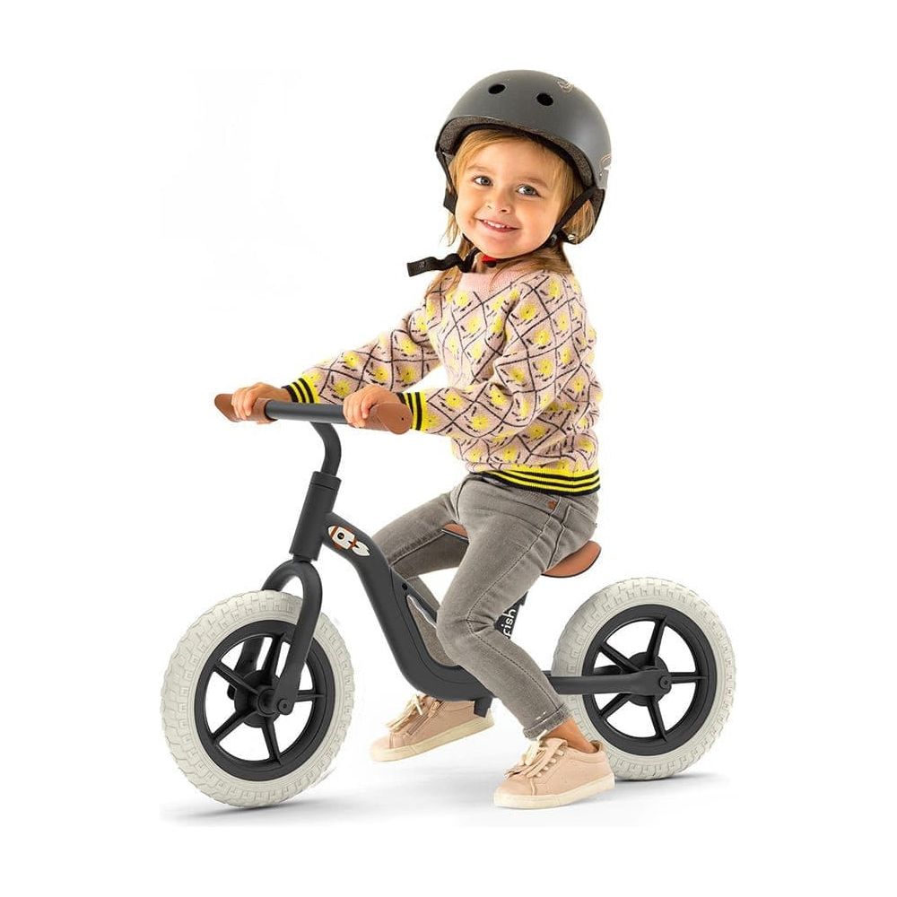 Little boy riding Chillafish Charlie 18M-4Y Balance Bike in Black