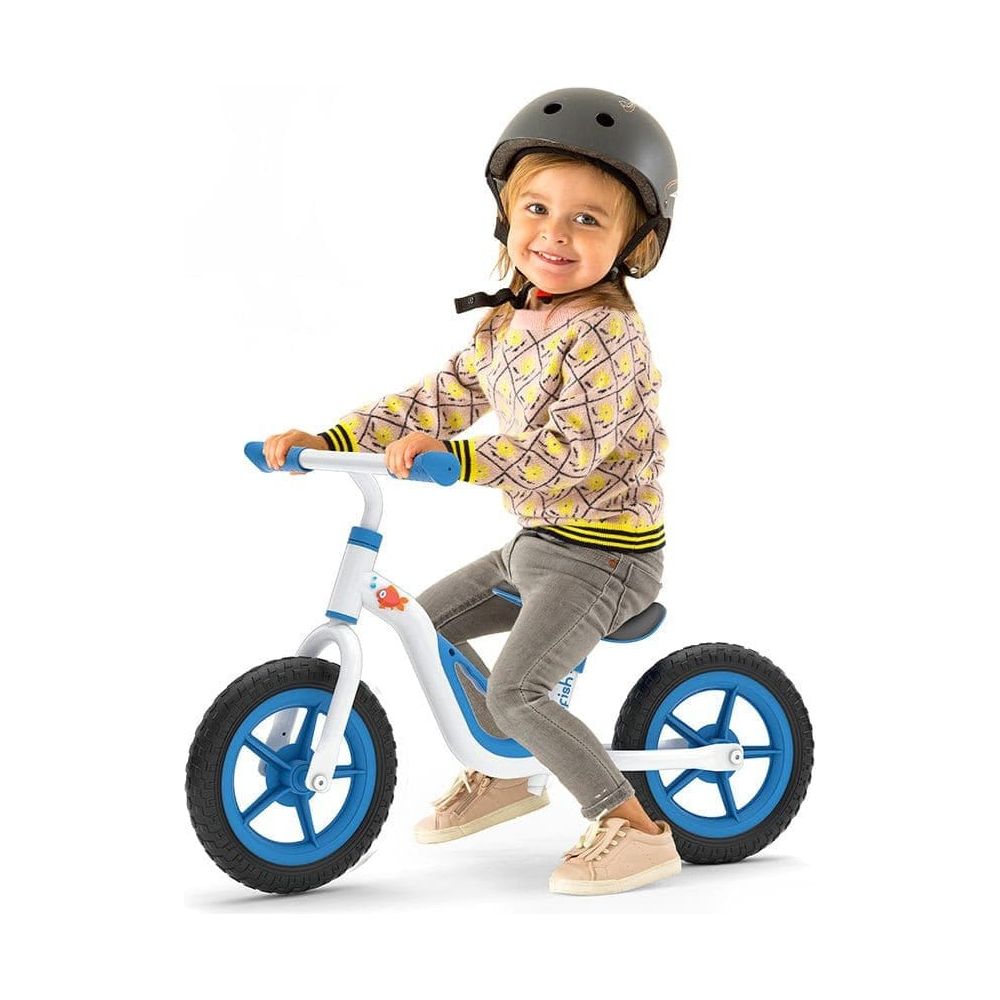 child riding Chillafish Charlie Balance Bike 18M-4Y in Blue