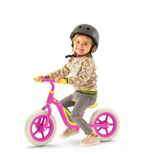 child riding Chillafish Charlie Balance Bike 18M-4Y in Pink