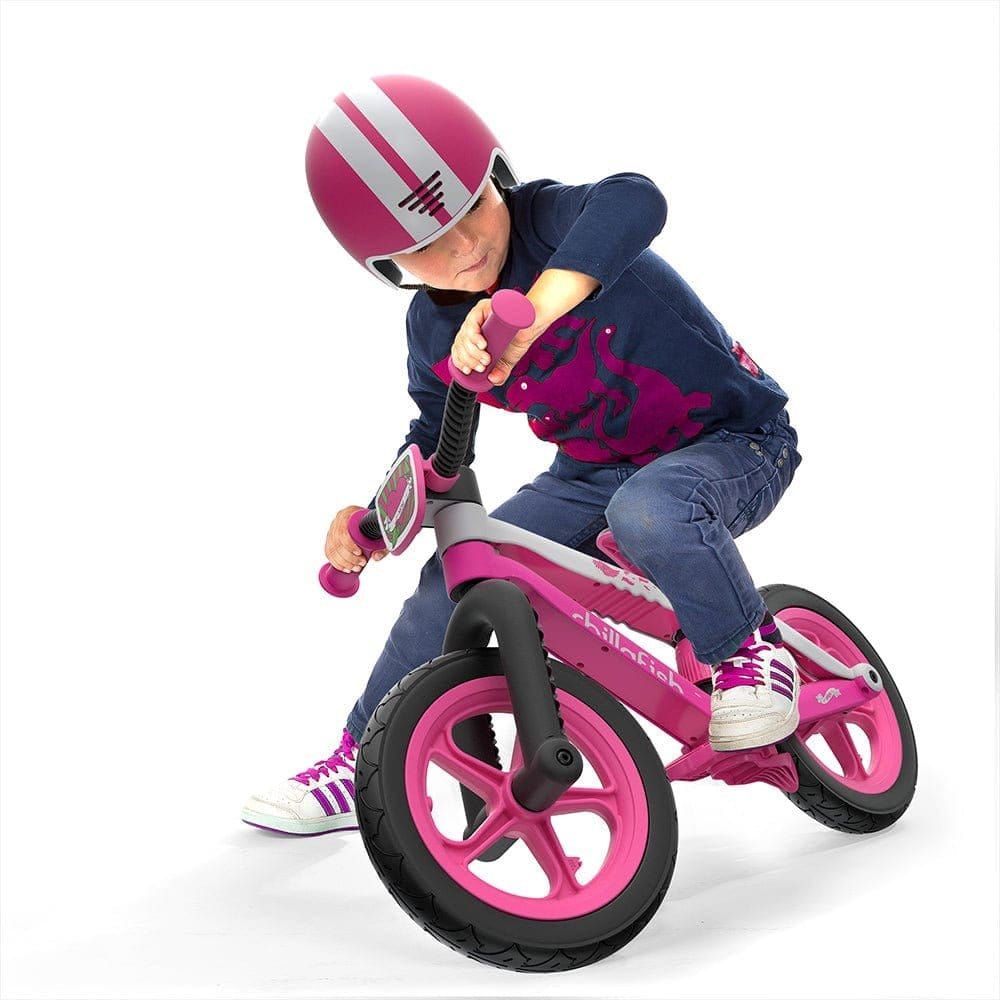 Little boy riding Chillafish Bmxie Balance Bike 2-5 Years in Pink