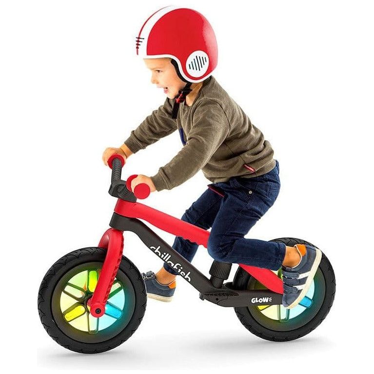 Little boy riding Chillafish Bmxie Glow Balance Bike 2-5 Years in Red