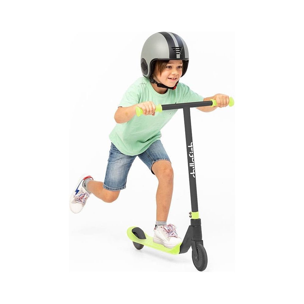 boy riding Chillafish Stunti 2 Wheel Scooter in Pistachio Green with one foot in the air