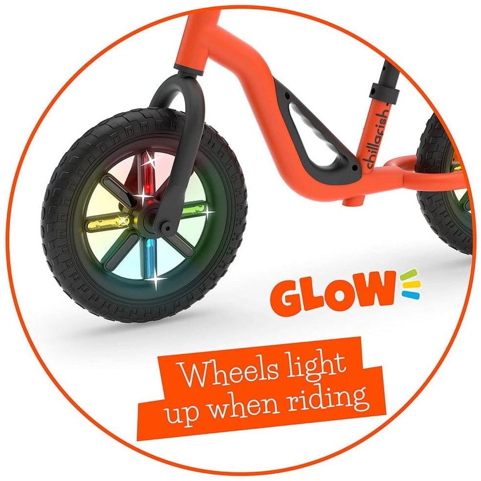Chillafish Charlie Glow Balance Bike 18M-4Y in Orange with light up wheels