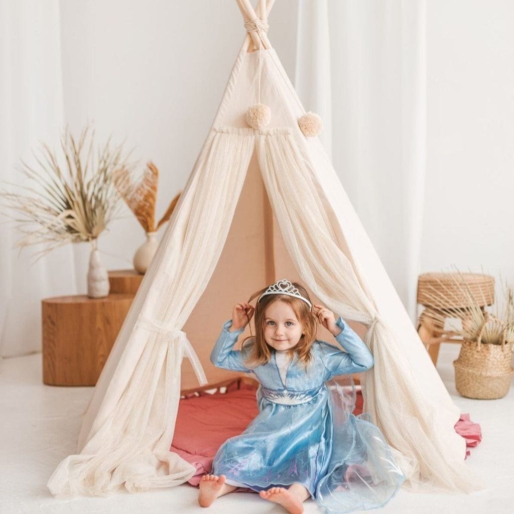 girl in blue dress with tiara sitting in MINICAMP Fairy Kids Play Tent With Tulle in Ecru