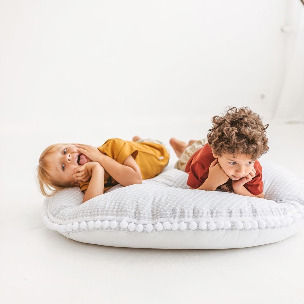 two children lying on MINICAMP Big Floor Cushion Rhombus Diamond - Grey