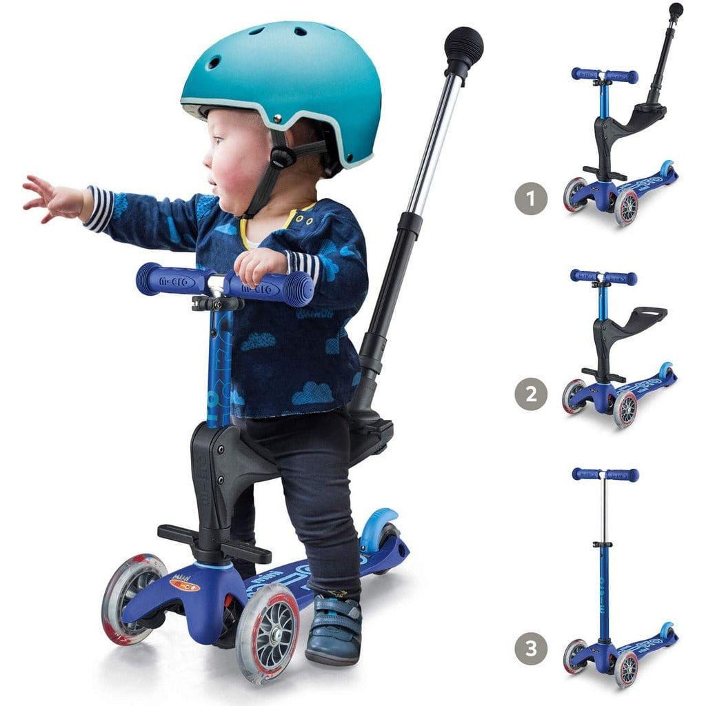 boy sitting on Micro Scooter Mini 3-in-1 Deluxe - Blue