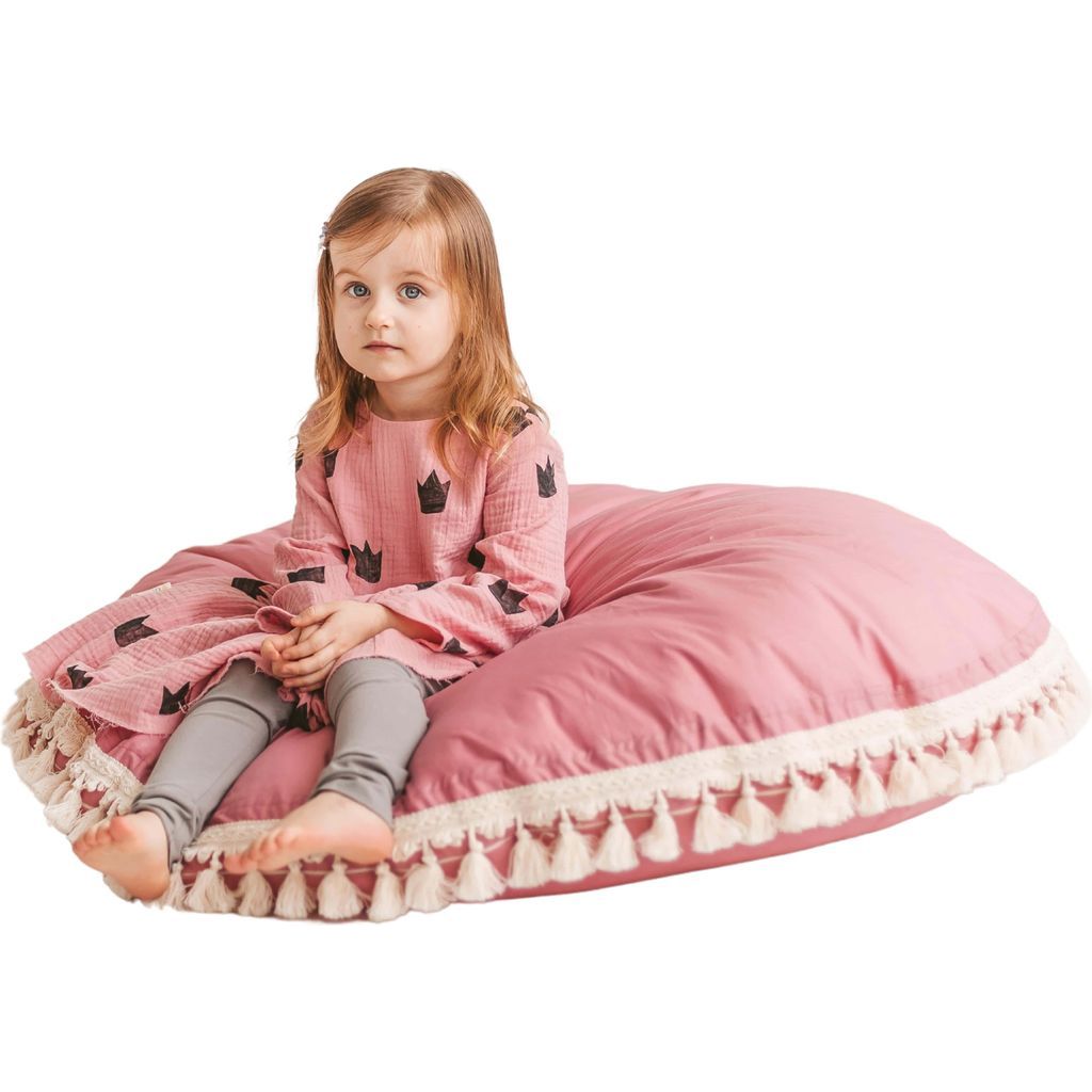girl sitting on MINICAMP Large Floor Cushion With Tassels in Rose