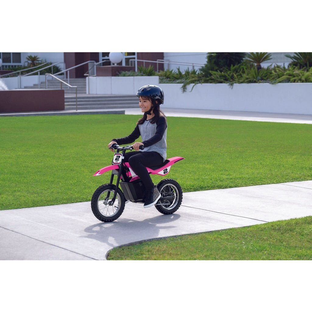 girl riding Razor Dirt Rocket MX125 12 Volt - Pink