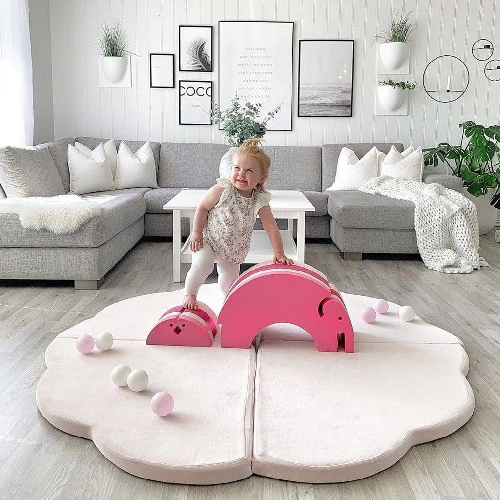 smiling girl climbing on Meow Baby Cloud Shaped Foldable Baby Play Mat