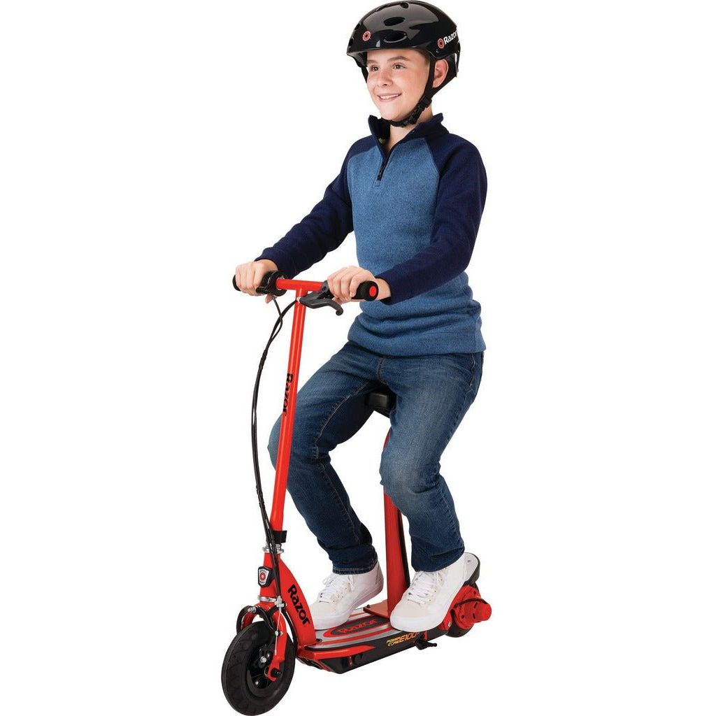 boy sitting on seat of Razor Power Core E100s 24 Volt Scooter - Red