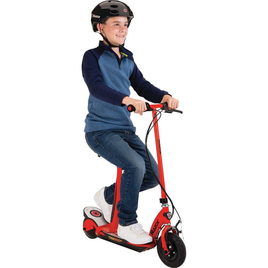 boy sitting on Razor Power Core E100s 24 Volt Scooter - Red front right