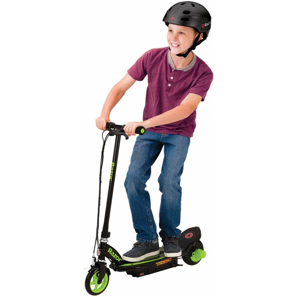 boy in helmet riding Razor Power Core E90 12 Volt Scooter - Green