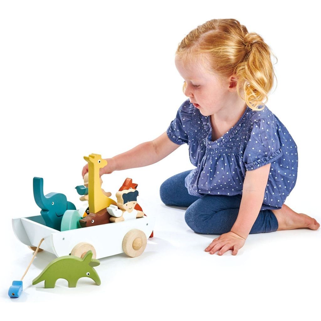 girl playing with Tender Leaf The Friend Ship Wooden Toy