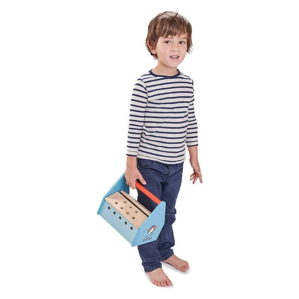 boy standing holding Tender Leaf Tap Tap Wooden Tool Box