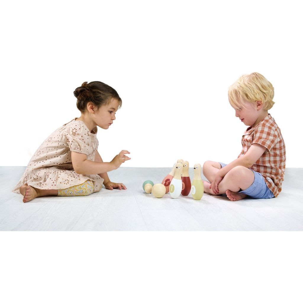 boy and girl playing with Tender Leaf Birdie Skittles Wooden Toy