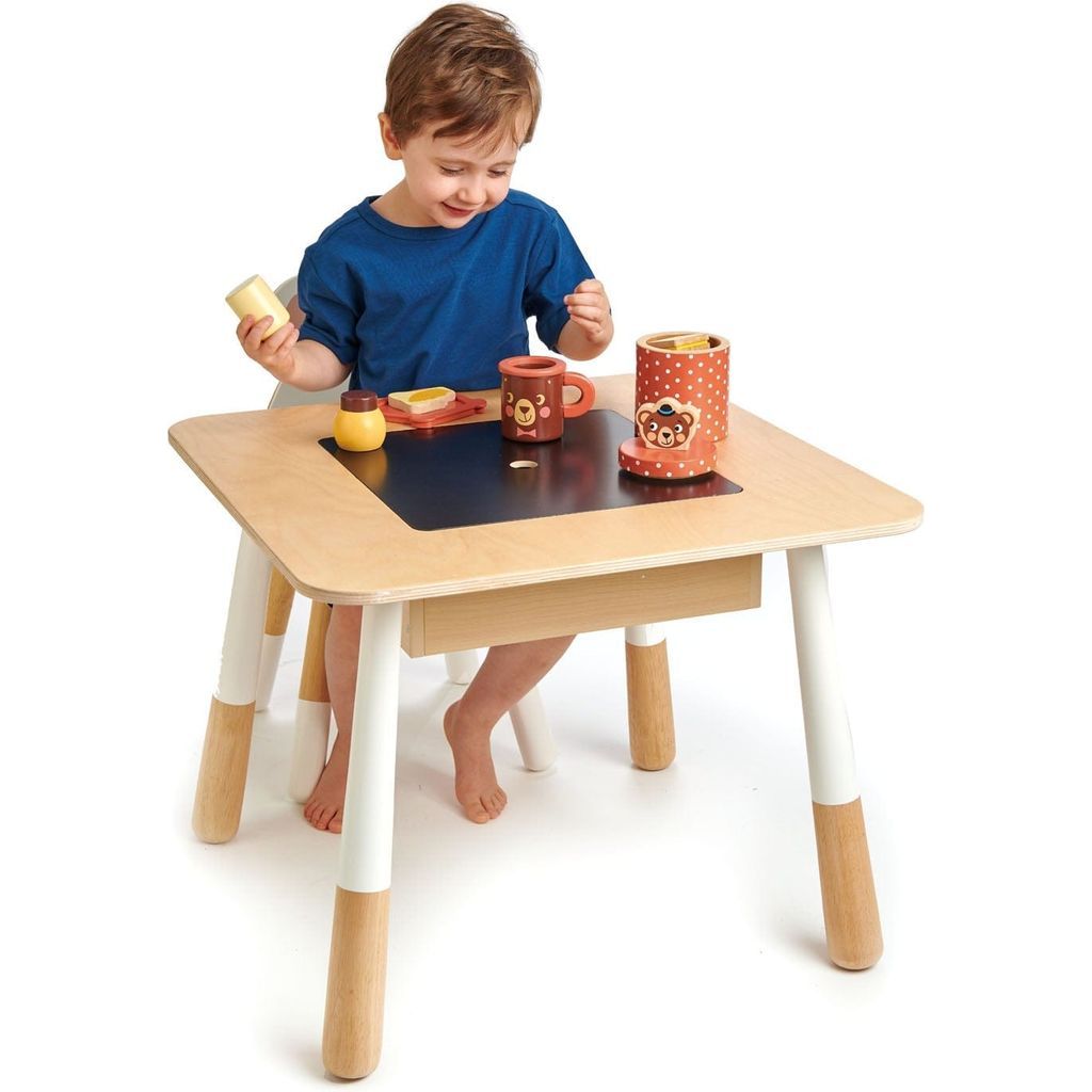 boy sitting at Tender Leaf Kids Wooden Forest Table and Chairs Bundle