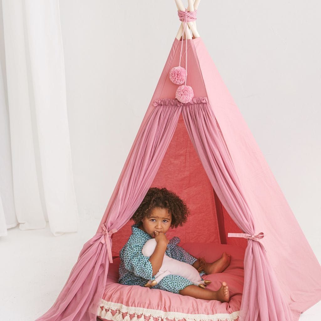 girl sitting in MINICAMP Fairy Kids Play Tent With Tulle in Rose