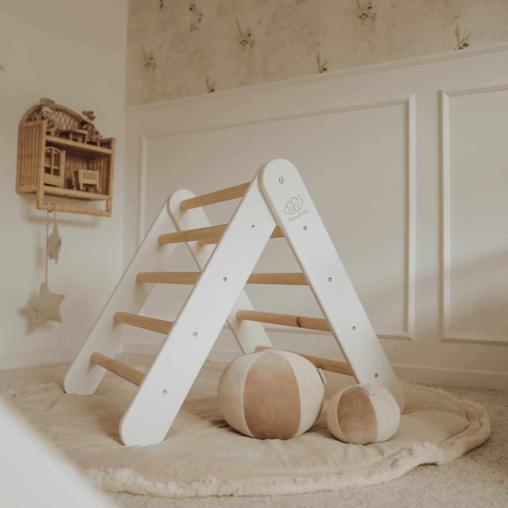 Montessori Wooden Climbing Triangle - White on rug with soft toys