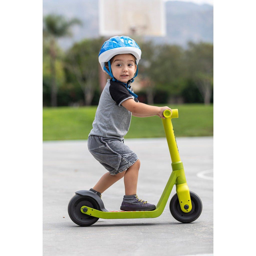 boy in helmet riding Razor Scooter Wild Ones - Dino
