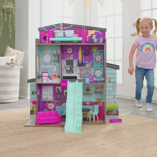 girl playing with Kidkraft Purrfect Pet Dollhouse