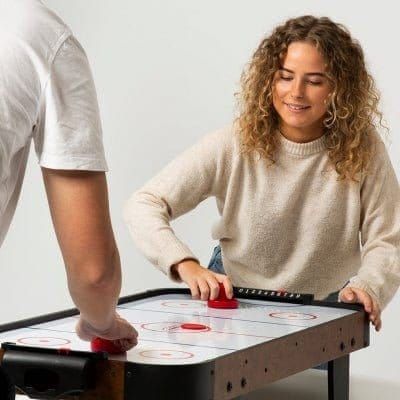 woman playing on Gamesson Buzz Air Hockey Table 