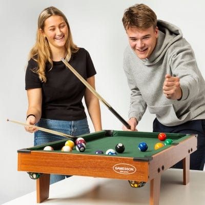 woman and man playing pool at Gamesson 3Ft Lth Mini Pool Table