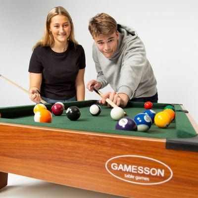 man playing pool on Gamesson 3Ft Lth Mini Pool Table