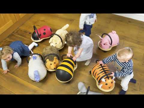 children playing with range of Wheelybug Plush Ride Ons