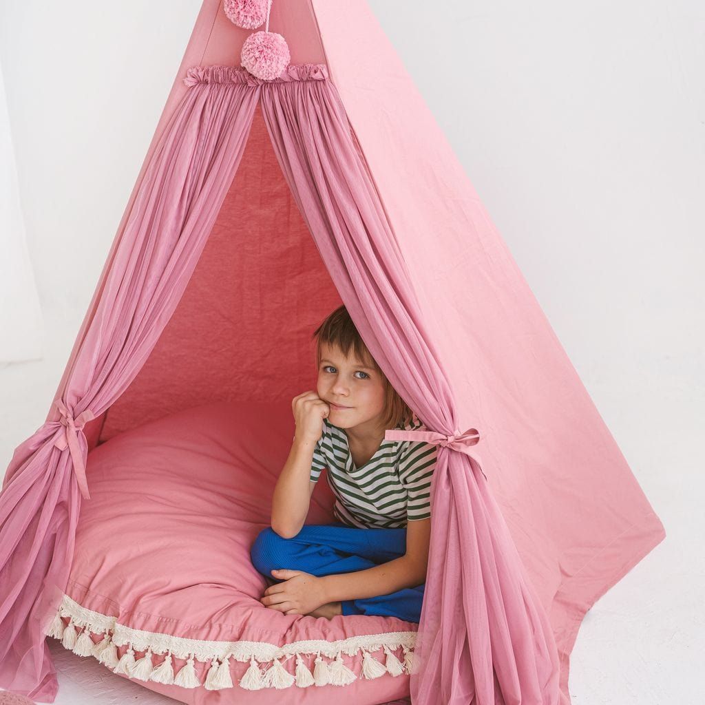 child sitting in MINICAMP Fairy Kids Play Tent With Tulle in Rose