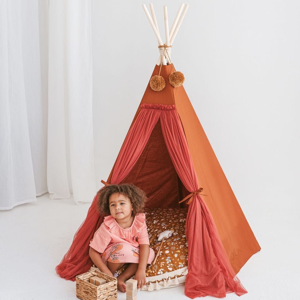 girl sitting in MINICAMP Fairy Kids Play Tent With Tulle in Cognac
