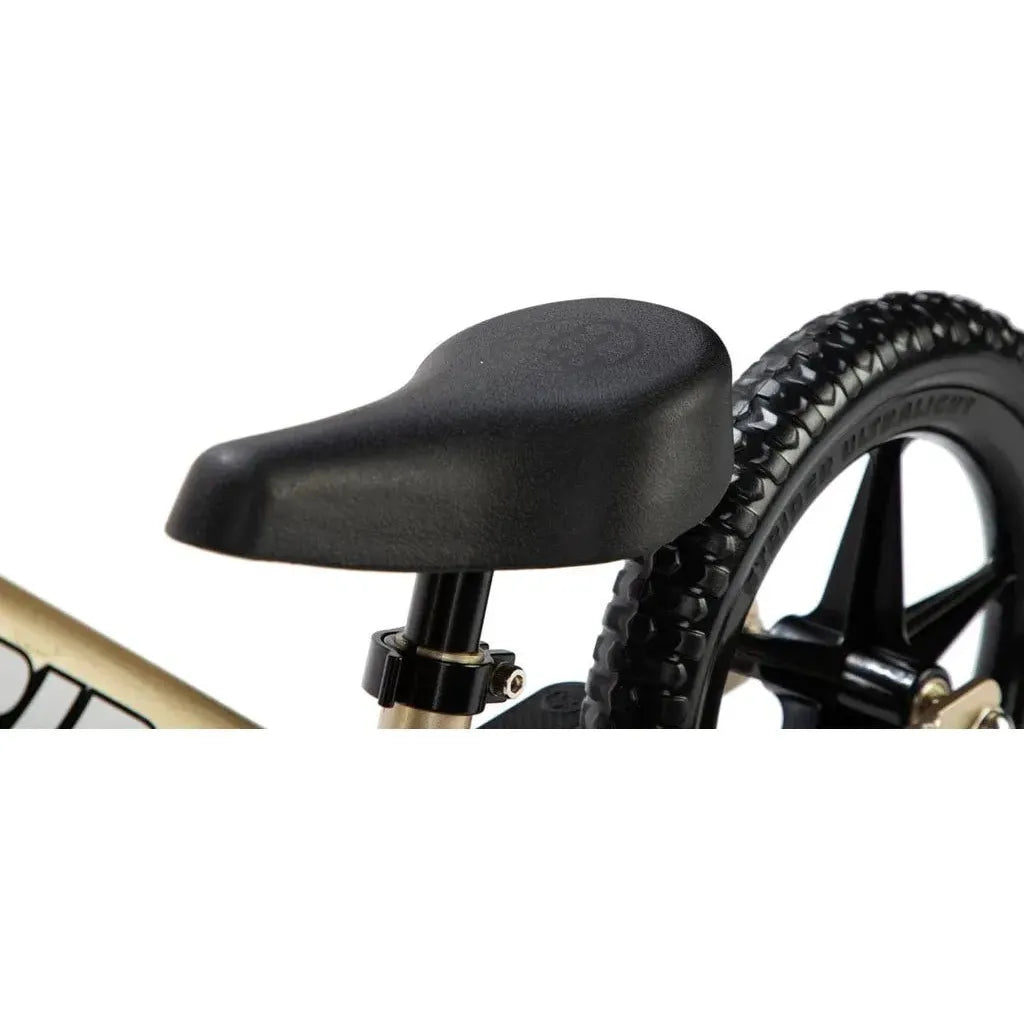 Strider Pro 12 inch Balance Bike - Gold seat close up