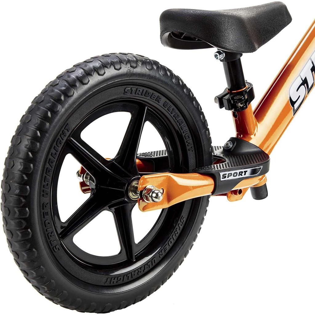Strider Sport 12 inch Balance Bike - Orange rear wheel close up
