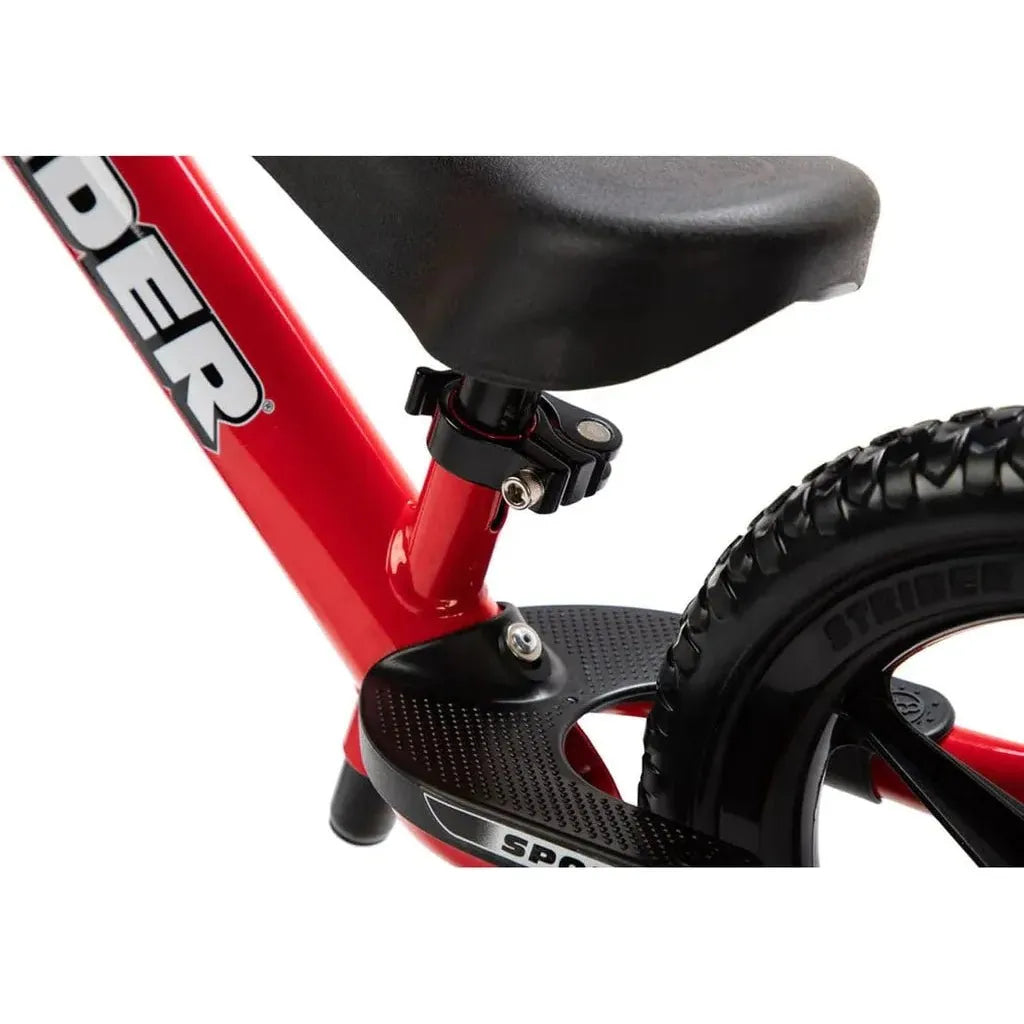 Strider Sport 12 inch Balance Bike - Red footrest close up