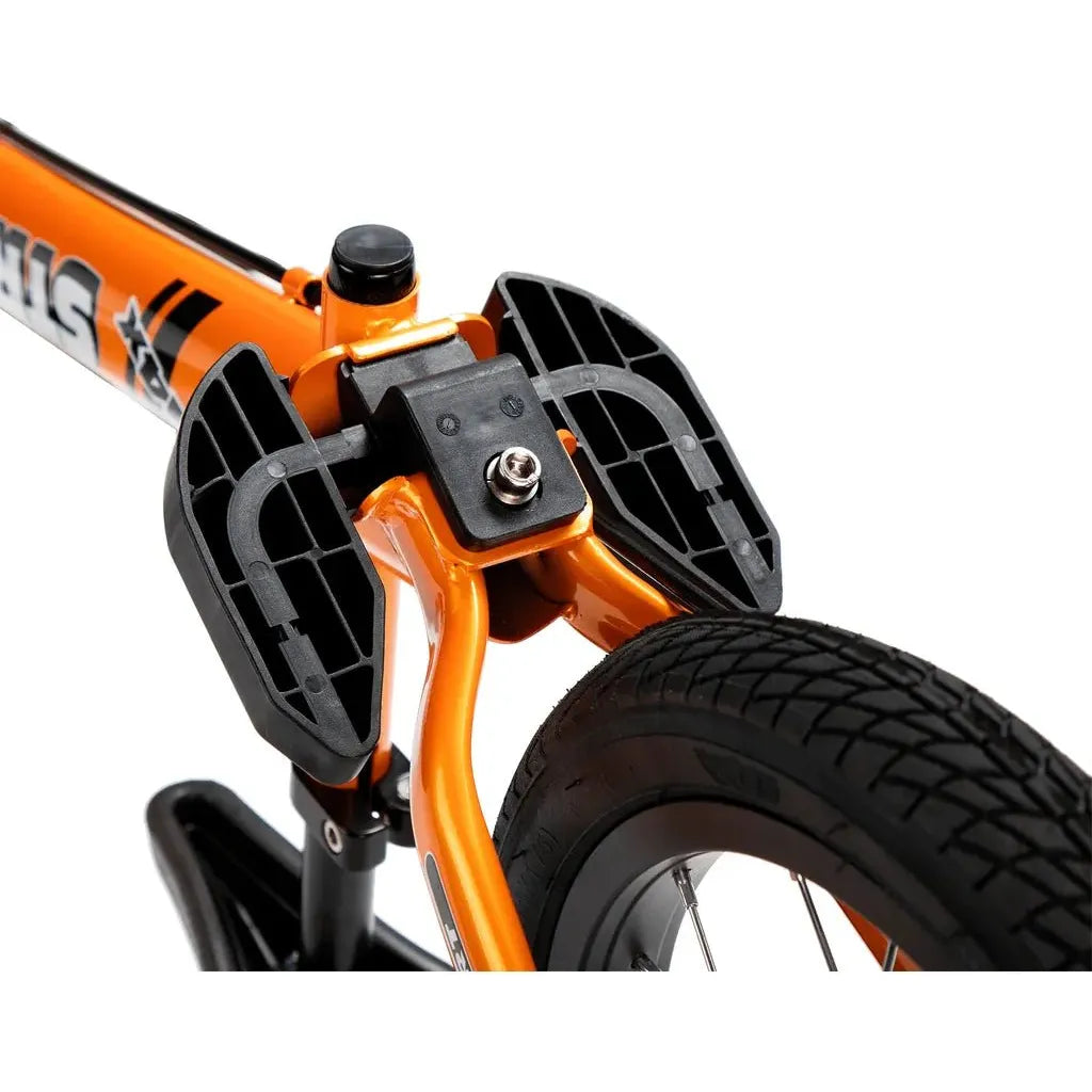Strider 14x Balance Bike - Tangerine adjustable footrest close up