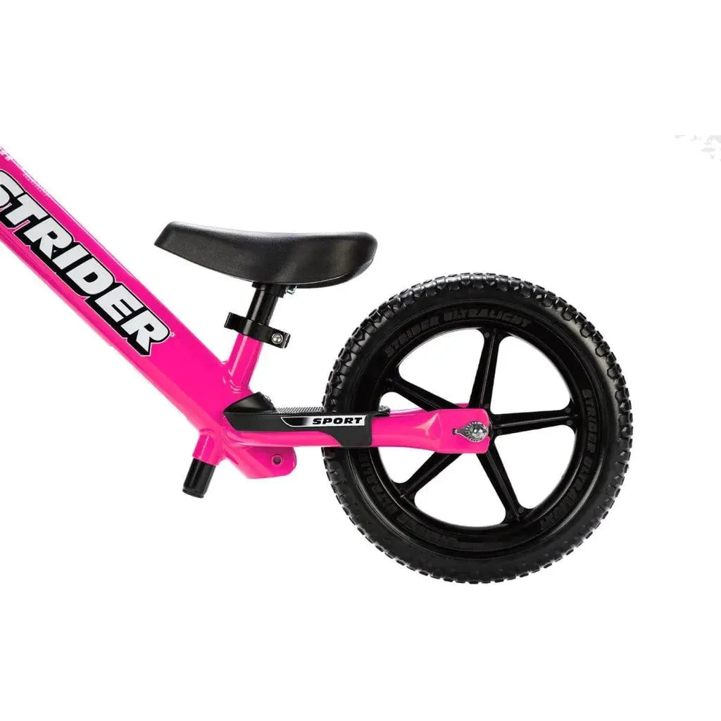 Strider Sport 12 inch Balance Bike - Pink rear wheel close up